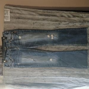 SILVER jeans with back pockets. Distressed denim. Barely worn.